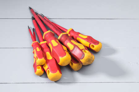 A set of a lot of different red tools for working include hammer screwdriver on gray backgroundの写真素材