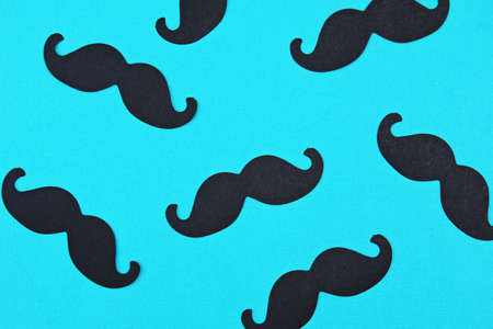 Fathers day card background on blue background. Composition of mustache. Fathers day holiday concept.の写真素材