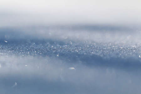 Winter snow. Snow texture Top view of the snow. Texture for design. Snowy white texture. Snowflakes.