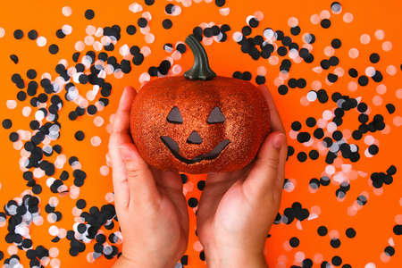 Halloween decorations on orange background. Halloween concept. Flat lay, top view. Trick or treat.の写真素材