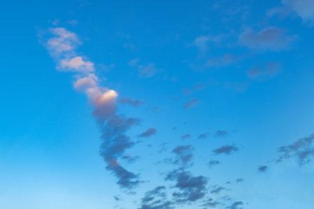 Blue sky with white clouds. Beautiful cloudy sky. Skyward. Endless skyline. The sky at dawn.