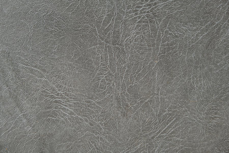 The texture of artificial leather. Background of black leather with patterns. Artificial material made of gray leather.の写真素材