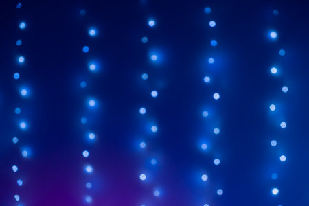 Christmas blue bokeh from garland neon light. Bokeh lights. Beautiful Christmas background....