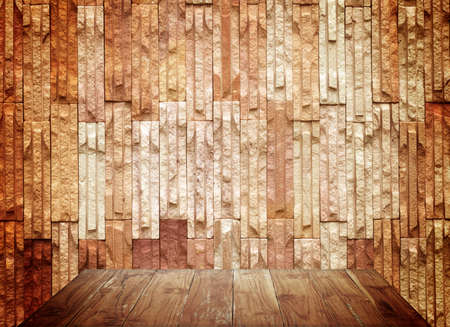 Empty top wooden shelves and stone wall background. For product displayの写真素材