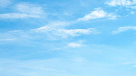 Fantastic soft white clouds against blue skyの写真素材