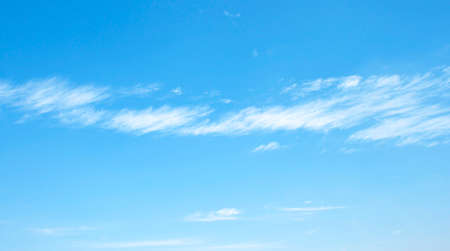 Fantastic soft white clouds against blue skyの写真素材