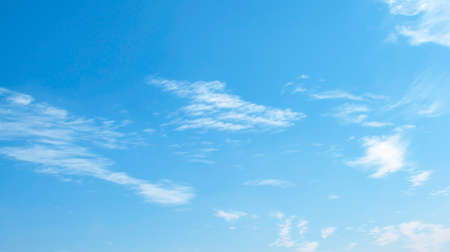 Fantastic soft white clouds against blue skyの写真素材