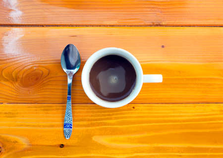 Hot coffee on wooden floorの写真素材