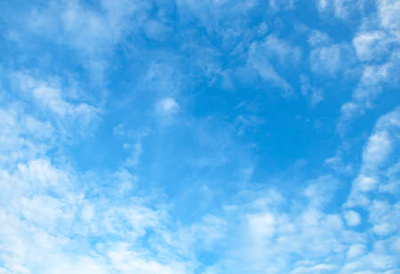 Fantastic soft white clouds against blue skyの写真素材