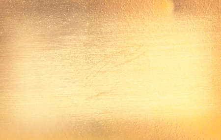 Shiny yellow leaf gold foil texture backgroundの写真素材