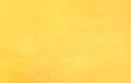 Shiny yellow  gold foil texture backgroundの写真素材