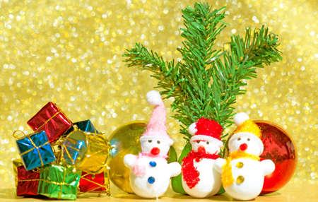 Christmas card with fir and decor on glitter background  bokeh Goldの写真素材