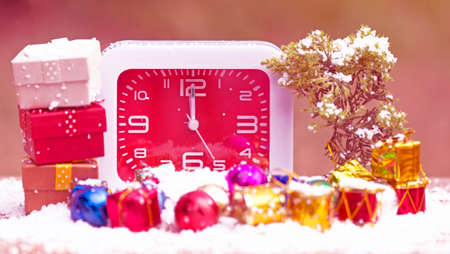 Clock with Christmas backgroundの写真素材