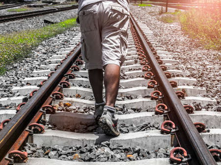 People walking on the railroadの写真素材