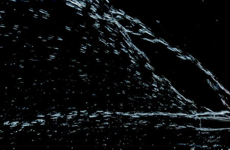 Splash water on black backgroundの写真素材