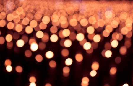 Gold glitter lights texture bokeh background Christmas. defocused