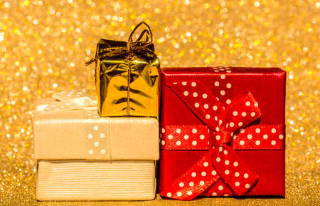Bokeh background gold and gifts.の写真素材