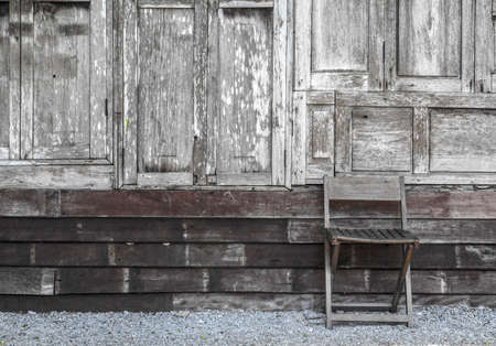 Old wooden walls and chairsの写真素材