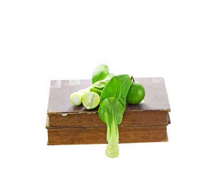 Green fruit and book backgroundの写真素材