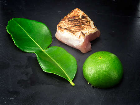 Meat on black stone board  backgroundの写真素材