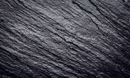 Dark grey black slate stone texture abstract backgroundの写真素材