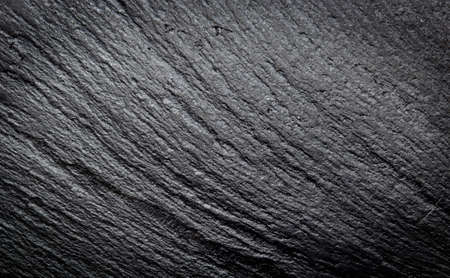Dark grey black slate stone texture abstract backgroundの写真素材