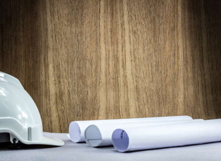 wood and An engineer hat on the desk backgroundの写真素材