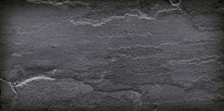 Dark grey black slate stone background or textureの写真素材