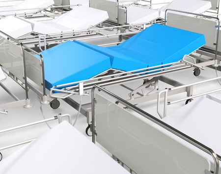 White hospital beds - focus on blue oneの写真素材