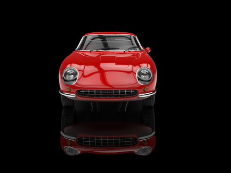 Red classic sports car - front view - isolated on black reflective backgroundの写真素材