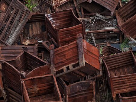 Heap of discarded rusty metal storage boxesの写真素材