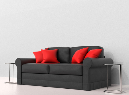 Black sofa with red pillows with two end tables on the sidesの写真素材