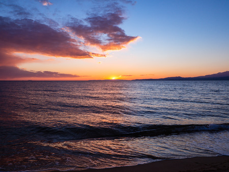 Beautiful bright sunset on the beachの写真素材