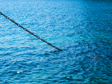 Big chain and deep blue seaの写真素材