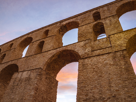 Ancient Roman architecture - brick aqueduct - low angle sunset shotの写真素材