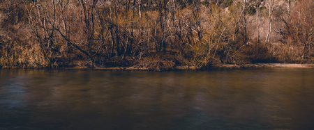 Dark river in late autumn