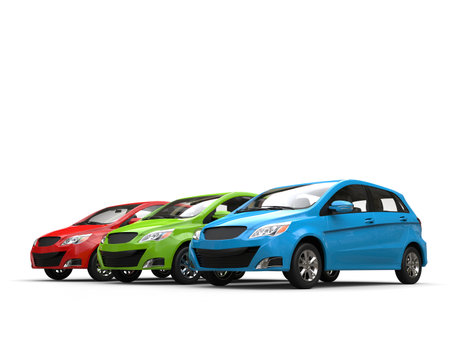 Modern small compact economic cars in red, green and blue colors - parked side by side on white backgroundの写真素材