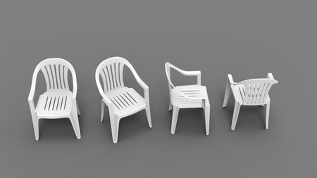 Basic white plastic lawn chairs - all sides view - top down shotの写真素材