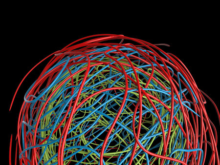 Ball of red, green and blue wires all entangled and entwined with each other - isolated on black backgroundの写真素材