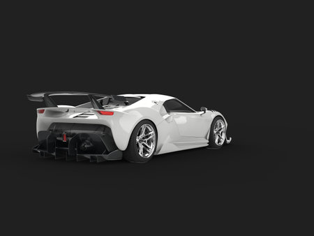 Clear white modern luxury super car on dark background - back viewの写真素材
