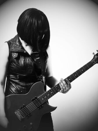 Woman with electric guitar, monochromeの写真素材