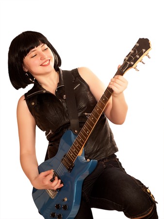 Young woman plays on a electric guitarの写真素材