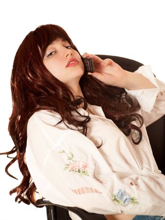 Young beautiful woman in armchair, isolatedの写真素材