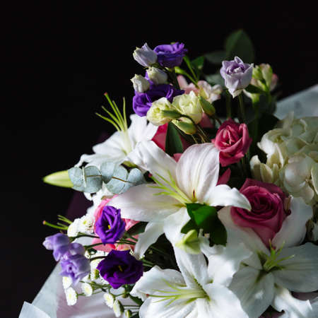 Bouquet of colorful flowers on dark background. Shallow depth of field and close-up.の写真素材