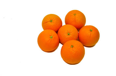 Oranges on a beautiful wooden plate. Tropical fruits.の写真素材