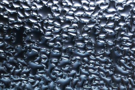 Waterdrops on a glass surface.の写真素材