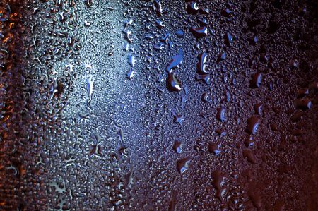 Waterdrops on a glass surface.の写真素材