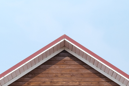The Roof Of The House With A Wooden Facade Against The Sky. Architecture. Texture, Background Series.の写真素材