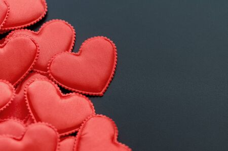 Valentine's Day Background/Theme. Red Hearts On A Black Background. Free Space For Text. Close-Up. Angle View.の写真素材