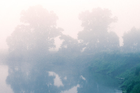A Strong Fog On The River Bank With A Forest. Landscape At Dawn.の写真素材